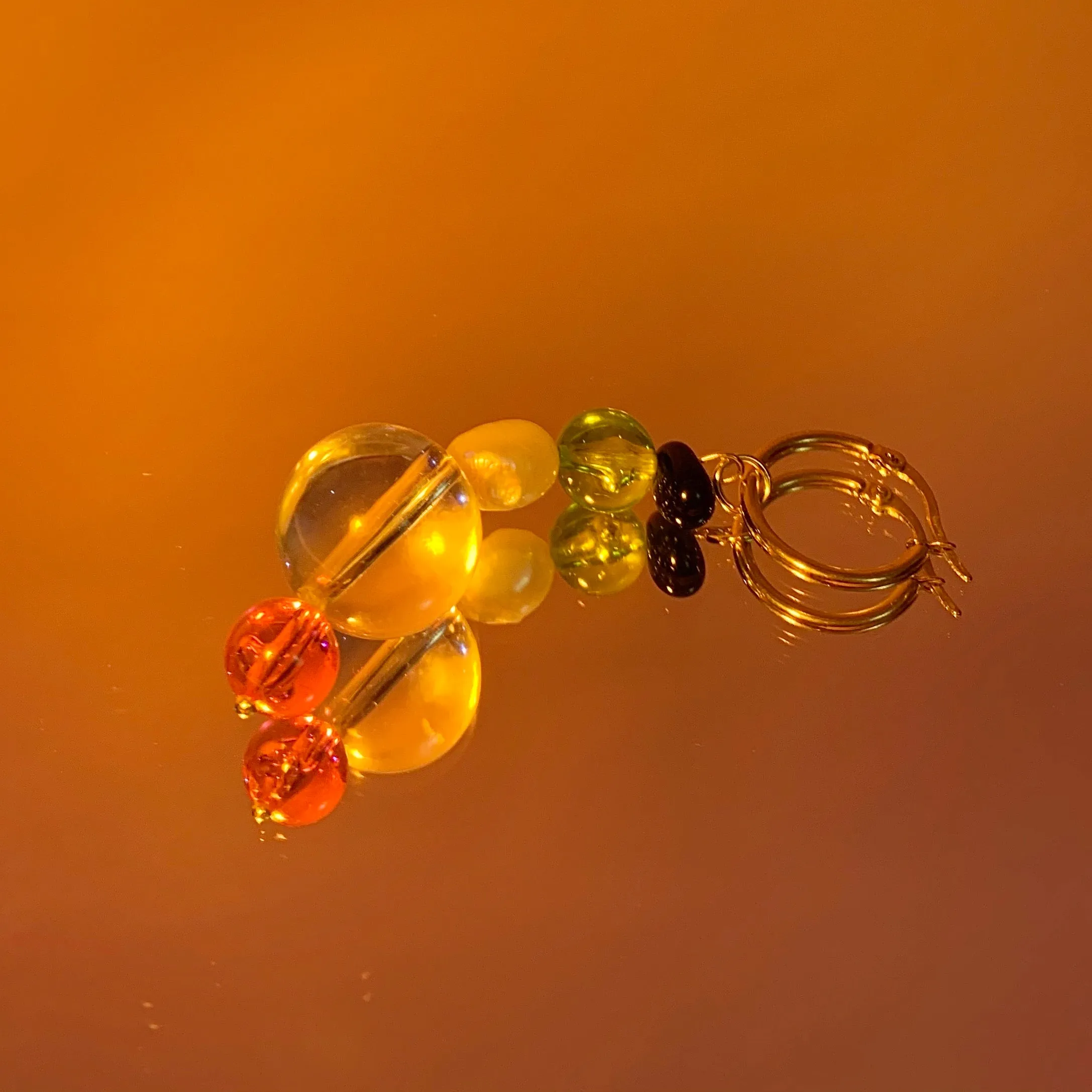 Beaded single squiggle earring