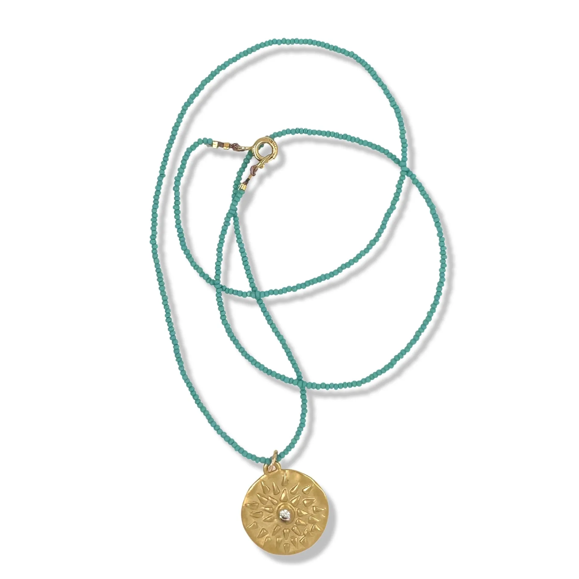 MIRA NECKLACE IN GOLD ON TURQUOISE BEADS