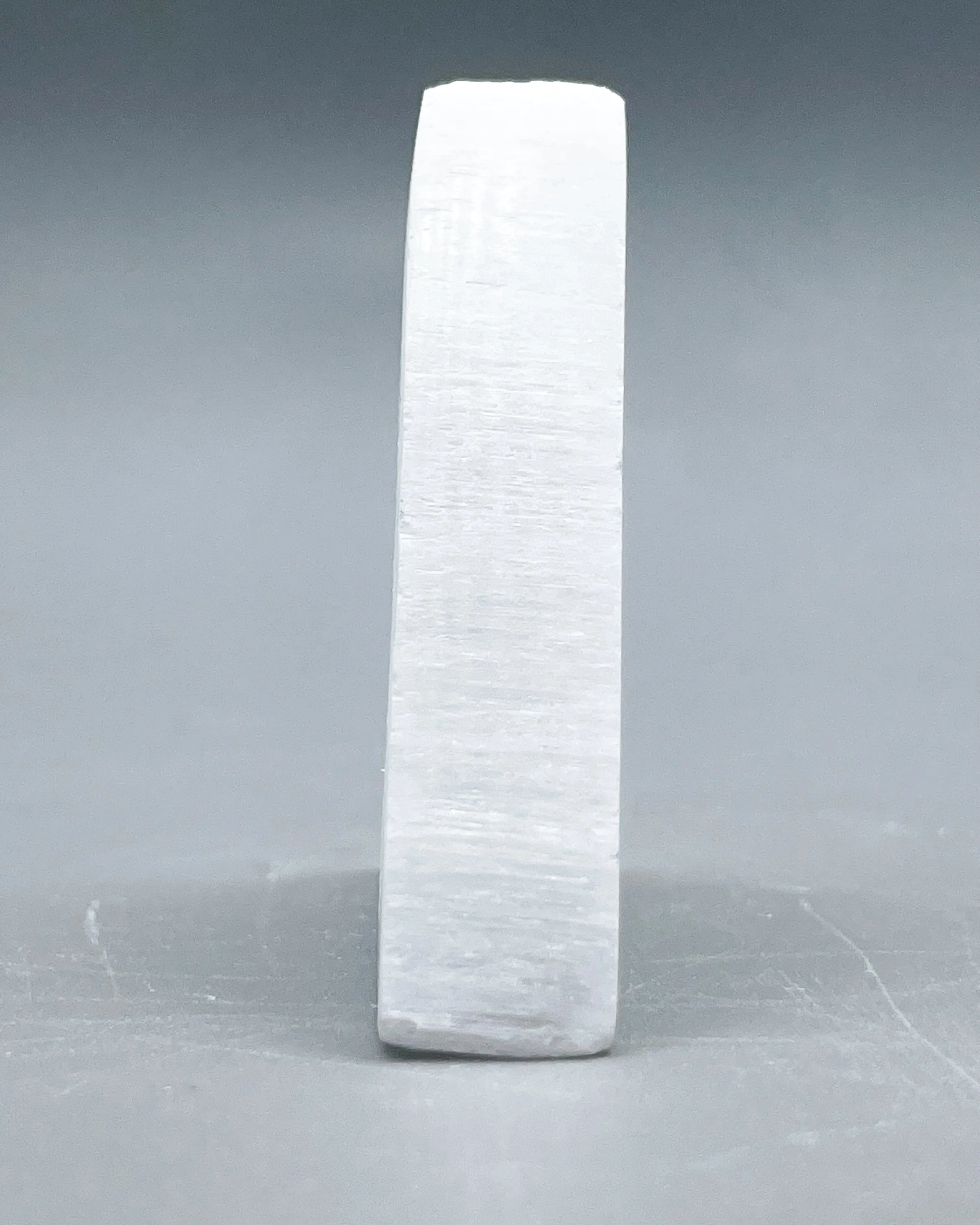 Selenite Ohm Triangle Carving