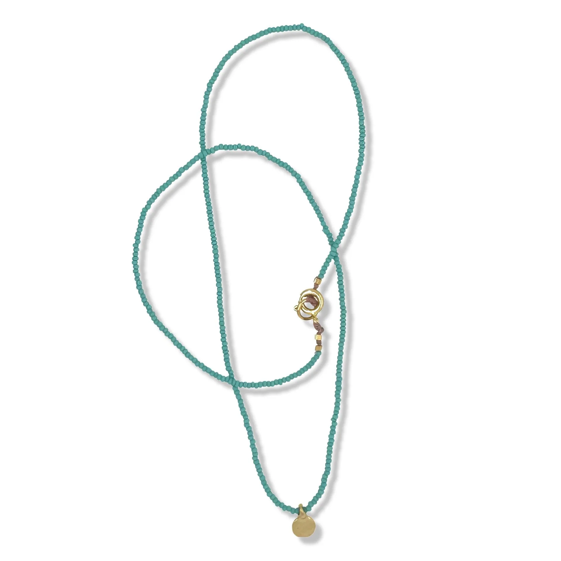 SINGLE GOLD DOT NECKLACE ON TURQUOISE BEADS